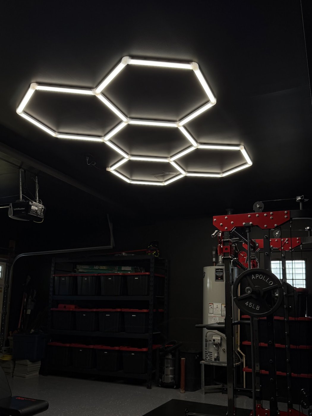 Hexagon ceiling lights glowing in a dark garage
