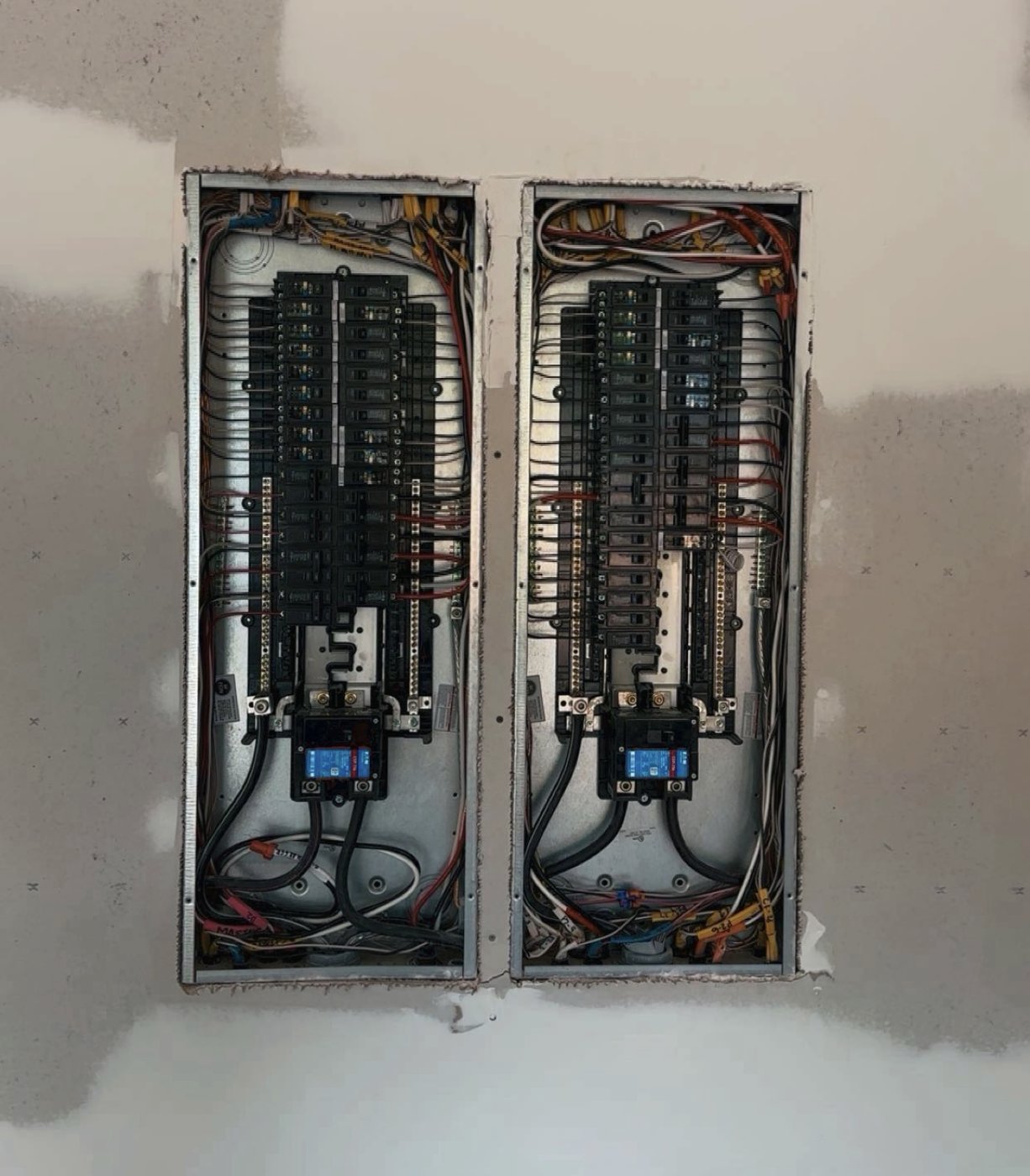 Open electrical panel with neatly routed, organized wiring