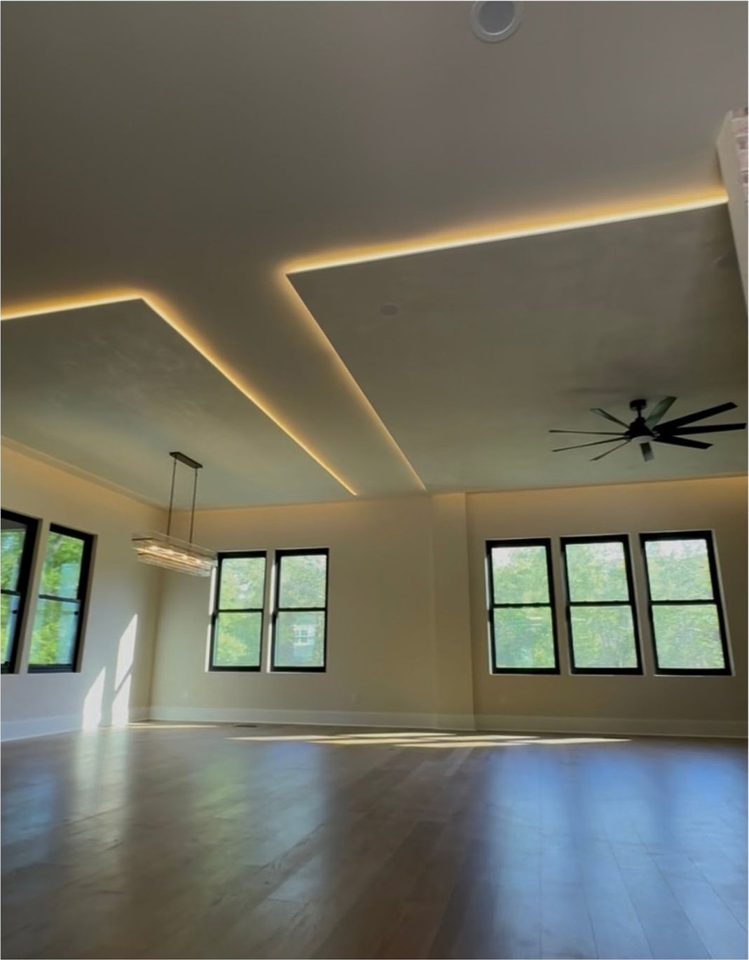 LED cove lighting glowing around the perimeter of a tray ceiling